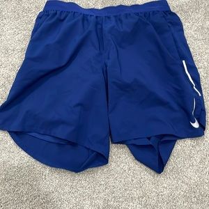 Blue Nike running shorts